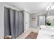 Bathroom featuring walk-in shower, vanity and linen closet at 2704 St Marys St, Raleigh, NC 27609
