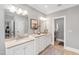 Bathroom featuring double vanities with stone countertops and ample drawer space at 2704 St Marys St, Raleigh, NC 27609