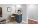 Bathroom vanity area featuring ample counter space and a decorative chair at 2704 St Marys St, Raleigh, NC 27609