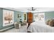 A bright bedroom with large windows, cozy chairs, and an elegant wardrobe at 2704 St Marys St, Raleigh, NC 27609