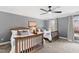 Bedroom showcasing twin beds with views of the front yard through bright windows at 2704 St Marys St, Raleigh, NC 27609