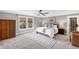 A serene bedroom with a large window, plush carpet, and a comfortable king-size bed at 2704 St Marys St, Raleigh, NC 27609
