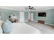 A stylish bedroom featuring soft blue walls, a ceiling fan, and a relaxing atmosphere at 2704 St Marys St, Raleigh, NC 27609