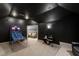 Spacious game room with a basketball game, comfortable seating, and a dark ceiling at 2704 St Marys St, Raleigh, NC 27609