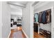 Hallway leading to a closet and the Main bedroom, all with wood floors at 2704 St Marys St, Raleigh, NC 27609