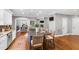 Kitchen island with cooktop, seating and view into dining room at 2704 St Marys St, Raleigh, NC 27609