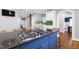 Kitchen island features gas cooktop, seating, and dark countertop at 2704 St Marys St, Raleigh, NC 27609