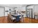 Spacious kitchen with stainless steel appliances, large island, and white cabinets at 2704 St Marys St, Raleigh, NC 27609