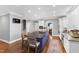 Open kitchen featuring stainless steel appliances, large island, and breakfast bar at 2704 St Marys St, Raleigh, NC 27609