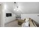 Relaxing living area featuring a comfortable couch, desk, and entertainment center at 2704 St Marys St, Raleigh, NC 27609
