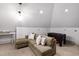 Cozy bonus room with comfortable seating, soft lighting, and game table at 2704 St Marys St, Raleigh, NC 27609