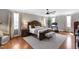 Main bedroom with king bed, wood floors, ceiling fan and lots of natural light at 2704 St Marys St, Raleigh, NC 27609