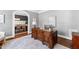 Cozy office space featuring a large wooden desk, neutral decor, and natural light at 2704 St Marys St, Raleigh, NC 27609
