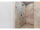 Tiled walk-in shower featuring rainfall shower head and glass door at 2704 St Marys St, Raleigh, NC 27609