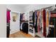 Spacious walk-in closet with custom shelving, hanging rods, and a secure safe at 2704 St Marys St, Raleigh, NC 27609
