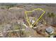Aerial view showcasing a wooded lot with property lines, a home, and surrounding neighborhood at 302 Weaver Ridge Rd, Rougemont, NC 27572