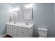 Elegant bathroom featuring double vanities, modern fixtures, and a serene ambiance at 302 Weaver Ridge Rd, Rougemont, NC 27572