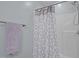 Bathroom with a shower featuring a decorative curtain and towel rack with soft towel at 302 Weaver Ridge Rd, Rougemont, NC 27572