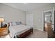 Comfortable bedroom showcasing a wooden bed frame and double door closet for storage at 302 Weaver Ridge Rd, Rougemont, NC 27572