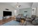Comfortable living room featuring a ceiling fan, hardwood floors, and ample seating space at 302 Weaver Ridge Rd, Rougemont, NC 27572