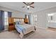 Cozy main bedroom featuring a ceiling fan, an attached bathroom, and plenty of natural light at 302 Weaver Ridge Rd, Rougemont, NC 27572
