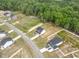 Aerial view of a community featuring large lots and tree lined backyards at 303 Old Fashioned Way, Lillington, NC 27546
