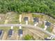 Aerial shot of a neighborhood with nicely maintained lots and tree line at 303 Old Fashioned Way, Lillington, NC 27546