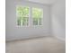 Cozy bedroom features carpet, natural light and large window views at 303 Old Fashioned Way, Lillington, NC 27546