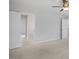 Spacious carpeted bedroom features a ceiling fan, closet and ensuite bathroom at 303 Old Fashioned Way, Lillington, NC 27546
