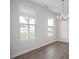 Bright dining area with large windows and contemporary lighting at 303 Old Fashioned Way, Lillington, NC 27546