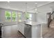 Modern kitchen boasts stainless steel appliances and an island perfect for entertaining at 303 Old Fashioned Way, Lillington, NC 27546