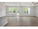 Light-filled open living area featuring views of the wooded landscape at 303 Old Fashioned Way, Lillington, NC 27546