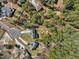 Aerial view of homes nestled among mature trees in a well-established neighborhood at 325 Cobblestone Dr, Spring Lake, NC 28390