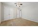 Bedroom with neutral paint, carpet flooring, and closet with bi-fold doors at 325 Cobblestone Dr, Spring Lake, NC 28390