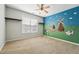 Bright bedroom featuring a ceiling fan and an adorable farm-themed mural at 325 Cobblestone Dr, Spring Lake, NC 28390