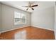 Empty bedroom with hardwood floors, natural light, and a ceiling fan at 325 Cobblestone Dr, Spring Lake, NC 28390