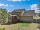 Exterior view of a two-story home with wood siding, a deck, and a fenced yard at 325 Cobblestone Dr, Spring Lake, NC 28390