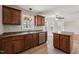 Kitchen showcasing wooden cabinets, an island, and stainless steel sink at 325 Cobblestone Dr, Spring Lake, NC 28390