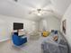 Cozy living room with a ceiling fan, comfortable seating, and modern decor in a relaxing space at 325 Cobblestone Dr, Spring Lake, NC 28390