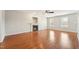 An empty living room featuring a fireplace, hardwood floors, and neutral walls at 325 Cobblestone Dr, Spring Lake, NC 28390