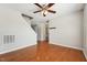 A spacious living room featuring hardwood floors, neutral walls, and a staircase at 325 Cobblestone Dr, Spring Lake, NC 28390