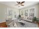Bright sunroom with large windows and comfortable seating at 325 Cobblestone Dr, Spring Lake, NC 28390