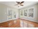Sunroom with hardwood flooring and large windows offering scenic views at 325 Cobblestone Dr, Spring Lake, NC 28390