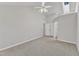 Bright bedroom featuring a ceiling fan, neutral carpet and vaulted ceiling with skylight at 3428 Singleleaf Ln, Raleigh, NC 27616