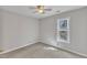 Bedroom featuring a ceiling fan and one window with wooded views at 3428 Singleleaf Ln, Raleigh, NC 27616