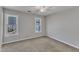 Cozy bedroom with a ceiling fan and two windows bringing in natural light at 3428 Singleleaf Ln, Raleigh, NC 27616