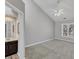 Spacious main bedroom with vaulted ceilings, large window and adjoining bathroom at 3428 Singleleaf Ln, Raleigh, NC 27616