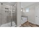 Modern bathroom featuring a tile shower, separate tub, and stylish tile flooring at 35 Wolf Ridge Ct, Willow Springs, NC 27592
