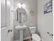 Powder room offers hardwood floors, pedestal sink, toilet, and modern finishes at 35 Wolf Ridge Ct, Willow Springs, NC 27592