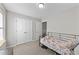 Bedroom showcasing a light-filled interior and a spacious double-door closet at 35 Wolf Ridge Ct, Willow Springs, NC 27592